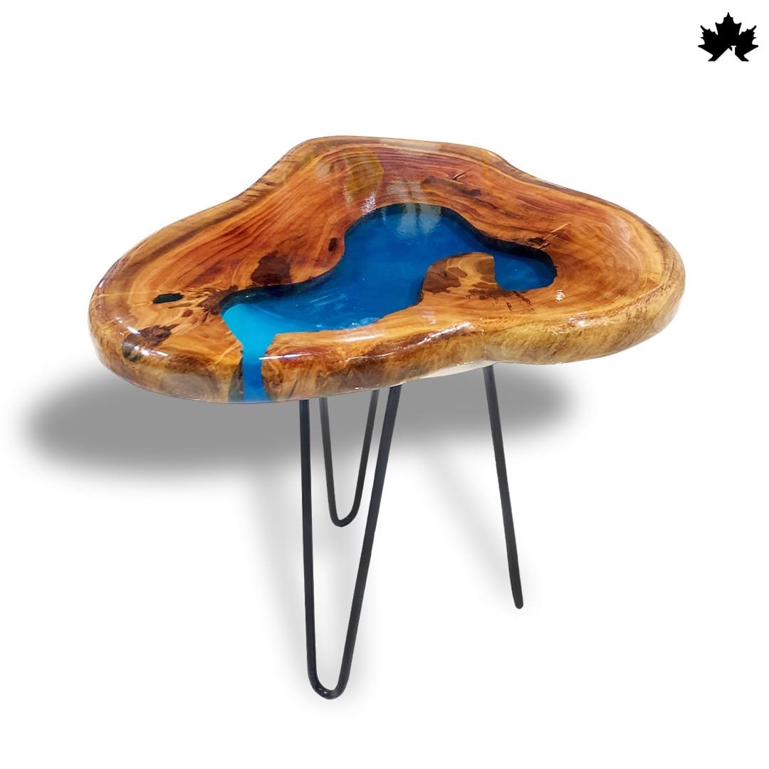 Unique Handcrafted Wooden coffee table featuring a natural wooden top with a vibrant blue resin insert that mimics a flowing river. The organic shape of the tabletop is enhanced by the clear